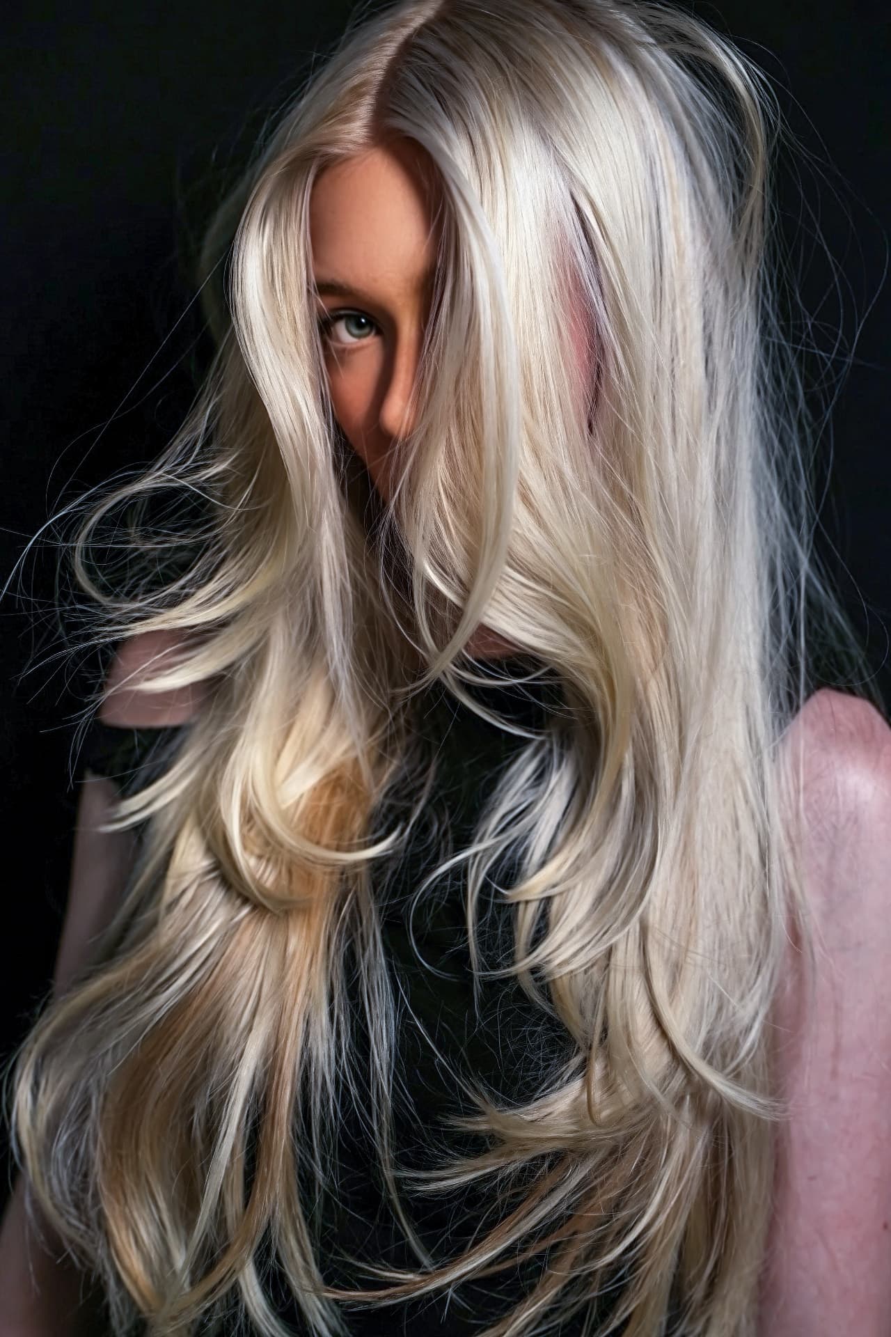 Model with long blonde hair styled for the collection