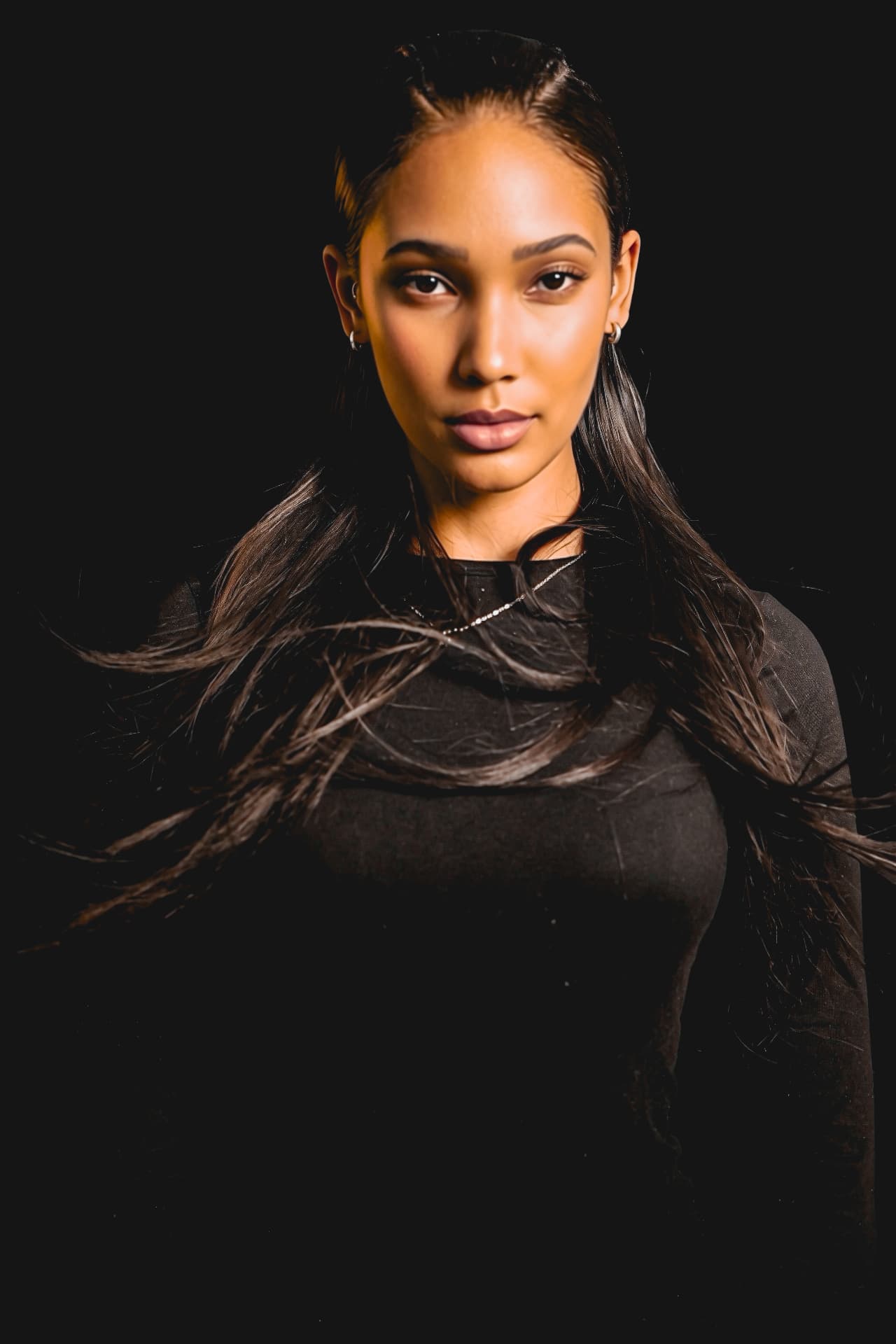 Side view of a dark-haired collection look