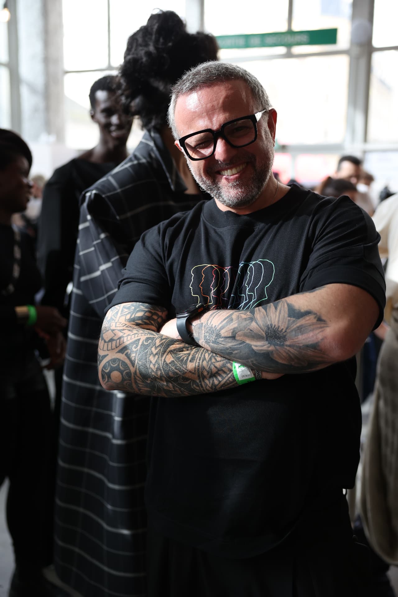 Christos Michailidis photographed at a fashion show