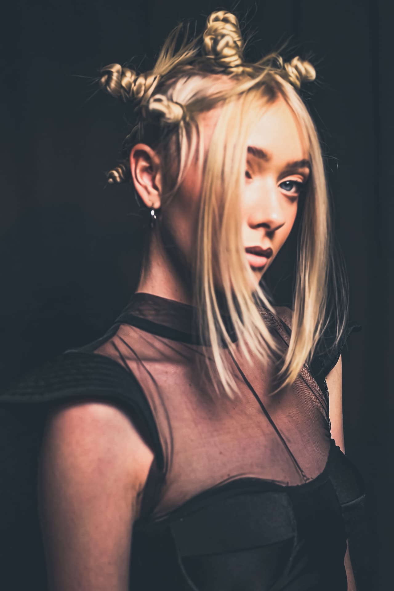 Model with intricate braided blonde hair artwork