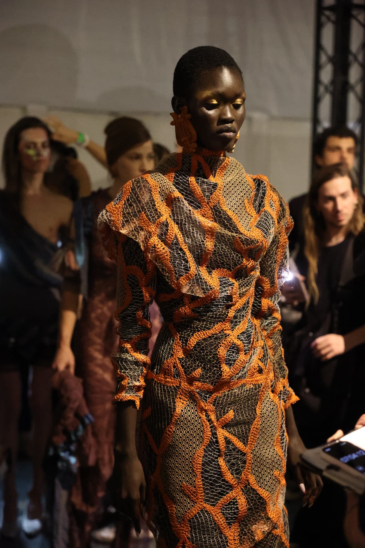 Model presenting a full fashion look with finished hair