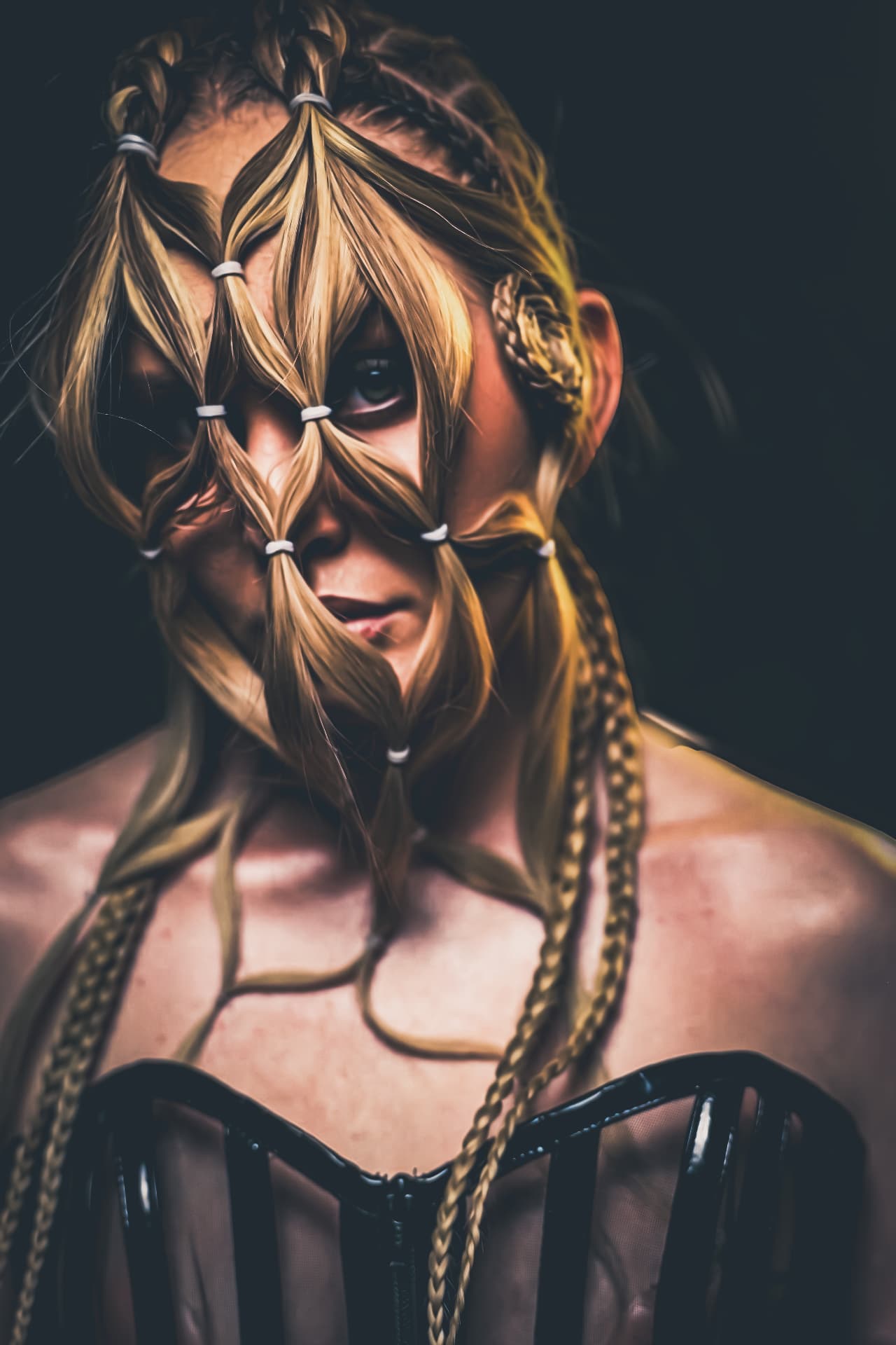 Blonde hair styled into knotted shapes