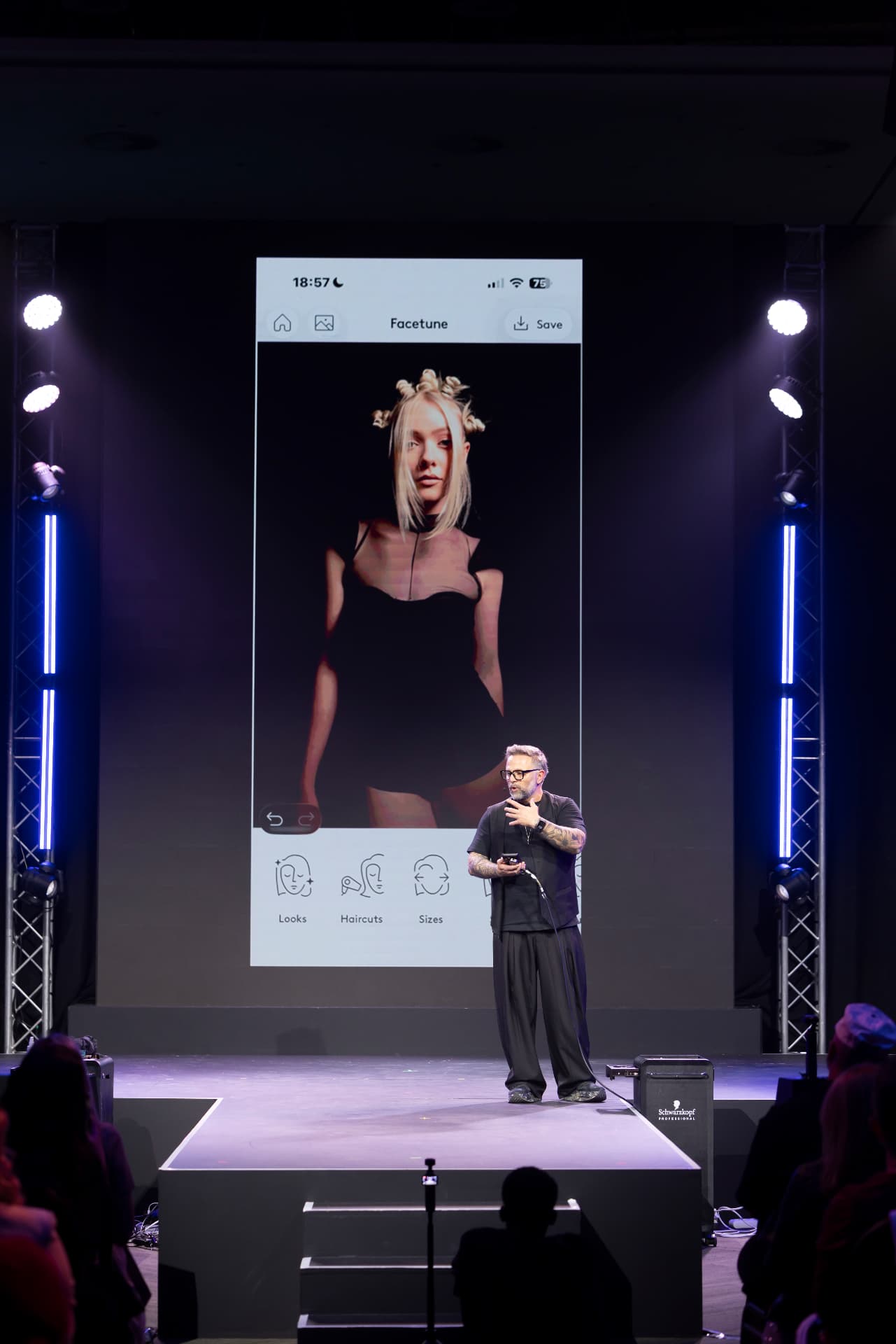 Christos Michailidis styling a model live on stage