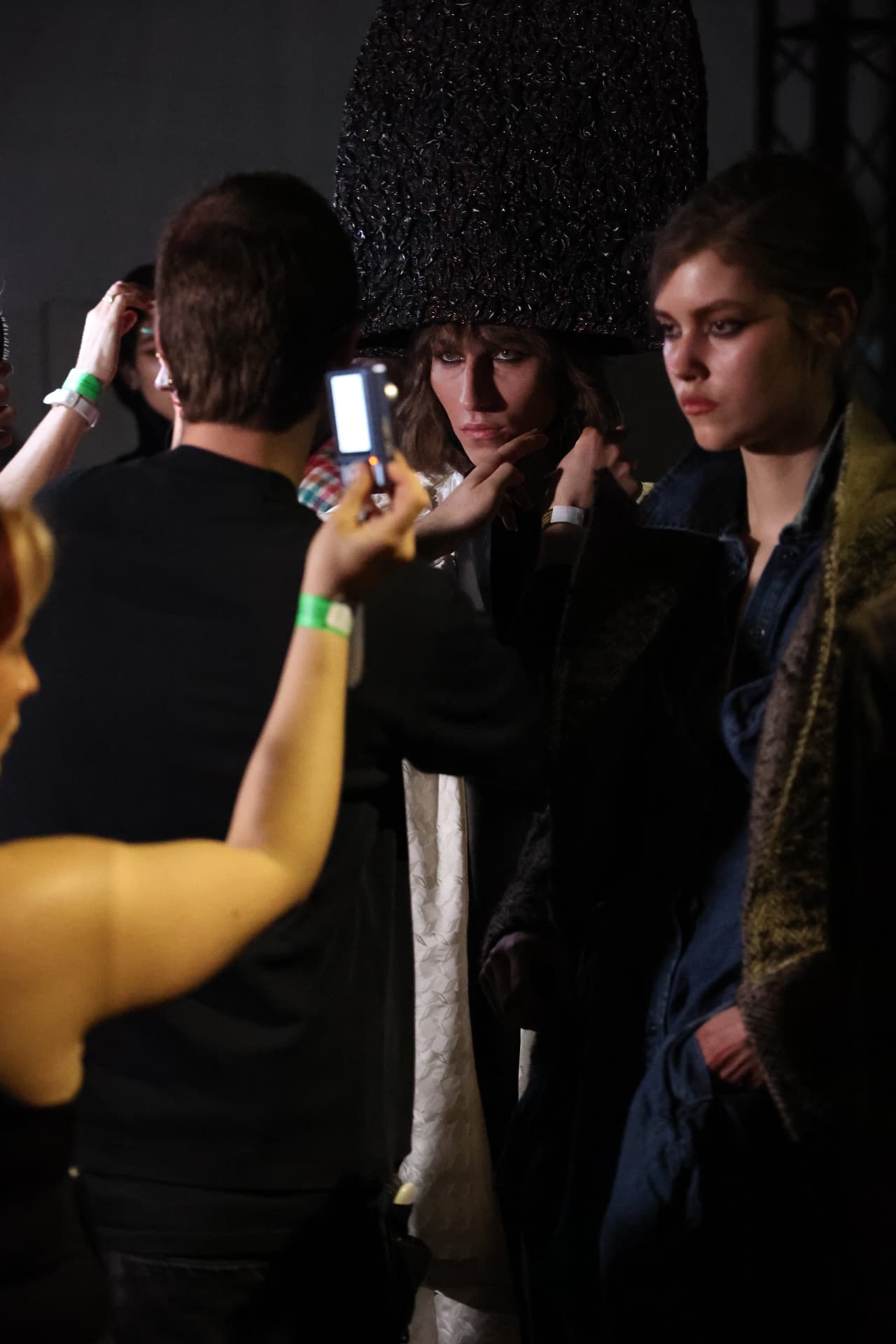 Backstage fashion moment with styled hair and full look